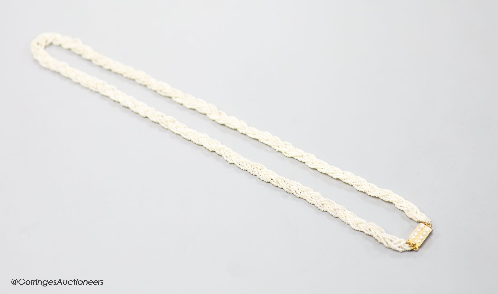 A 19th century 15ct and interwoven seed pearl choker necklace, 38cm.